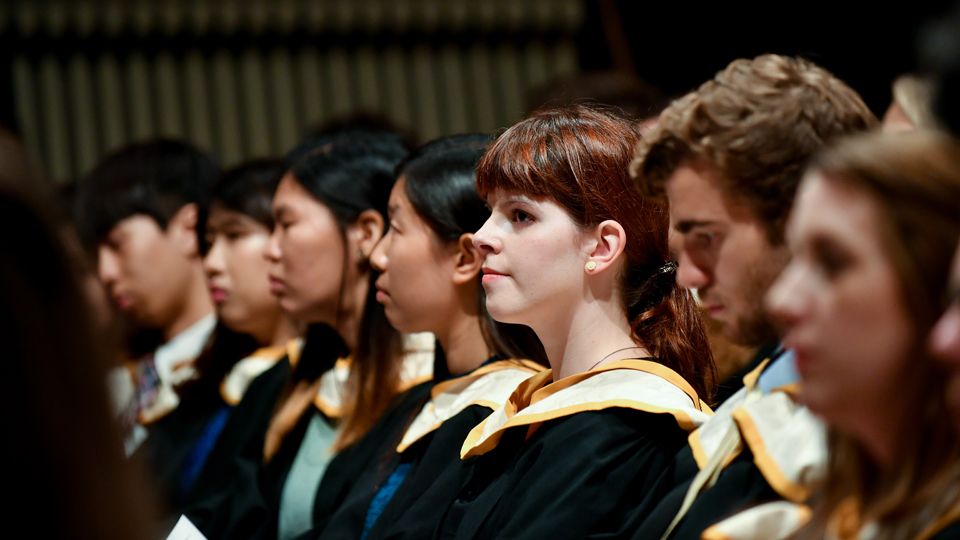 RCM graduands sitting in the Britten Theatre